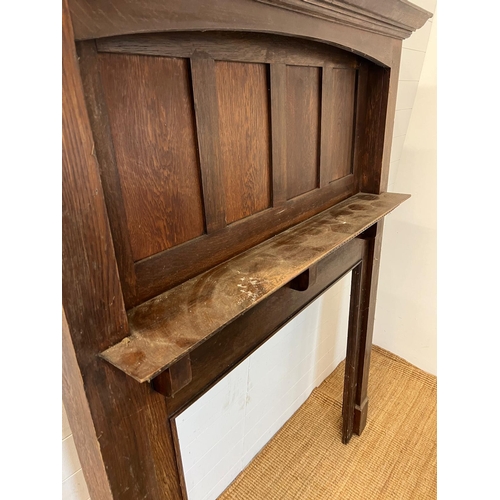 18 - An oak panelled fire surround 183cm x 142cm