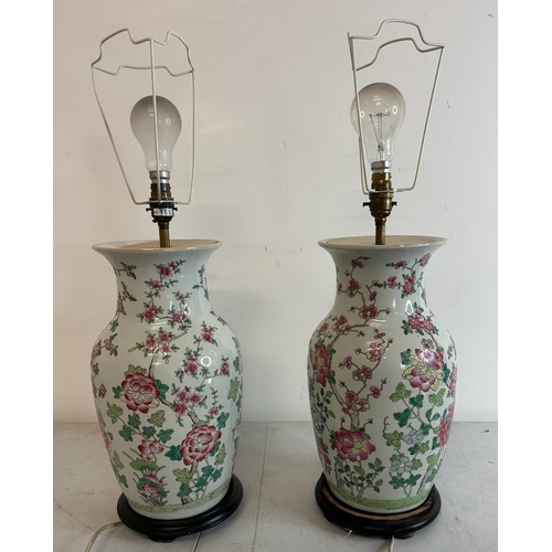 183 - A pair of Chinese ceramic vase table lamps with floral decoration