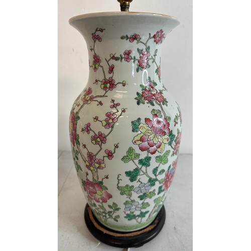 183 - A pair of Chinese ceramic vase table lamps with floral decoration