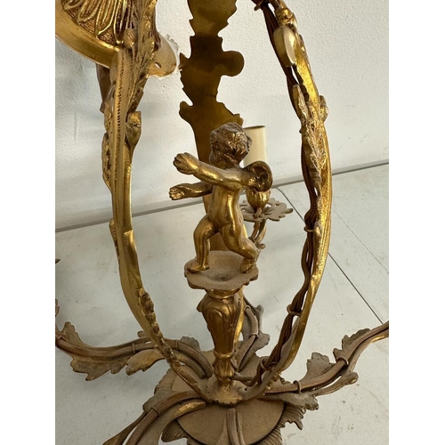 186 - A French five branch gilt chandelier with central cherub detail