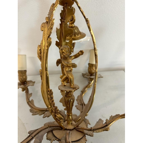 186 - A French five branch gilt chandelier with central cherub detail