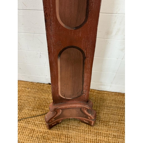 190 - A wooden floor standing prop lamp with tapering base