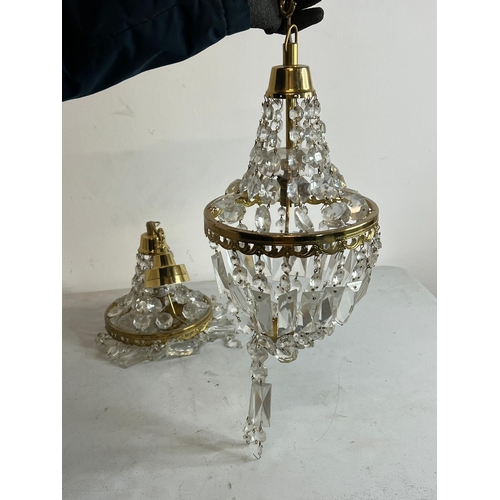 192 - Three Empire style chandelier with brass frame and crystal glass