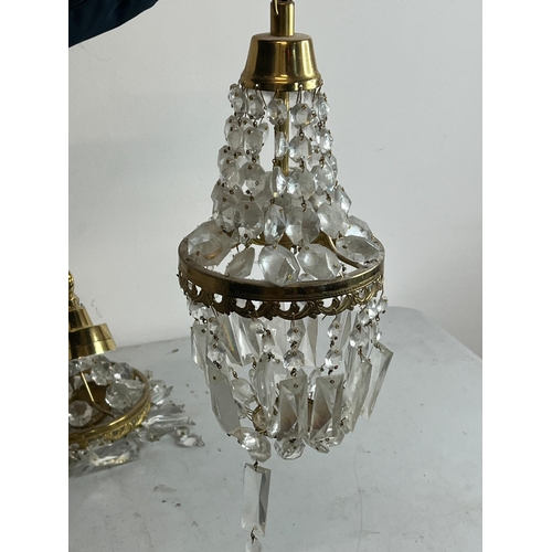 192 - Three Empire style chandelier with brass frame and crystal glass