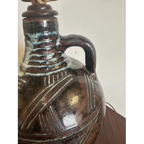 197 - A Studio pottery table lamp in the form of a jug, glazed brown ground with blues