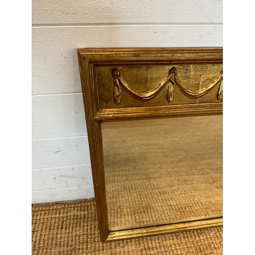 205 - A regency style gilt over mantle mirror with swag detail