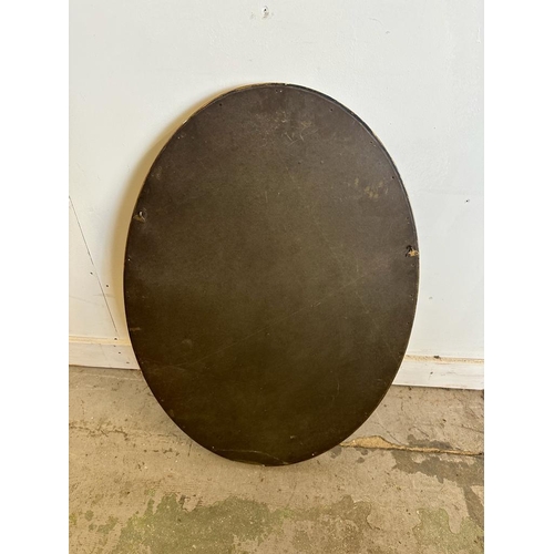 209 - A gold painted oval hall mirror with bevelled edge 84cm x 59cm