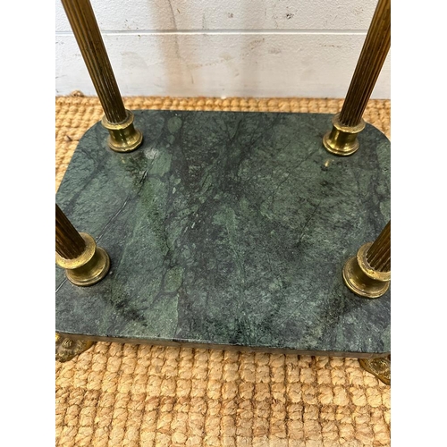 21 - A green marble topped plant stand on brass fluted column supports on brass lions paw feet (H91cm)