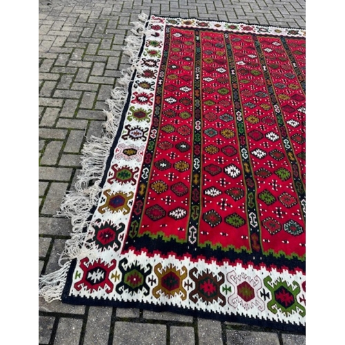 216 - A Kilim carpet, hand woven wool rug, cleaned and demanded