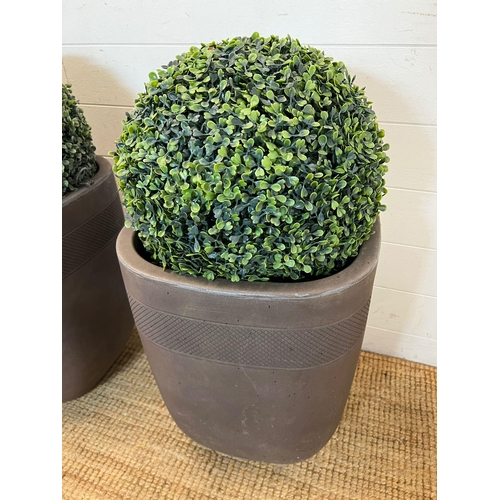 231 - A pair of faux garden box hedge topiary balls in planters (H78cm)