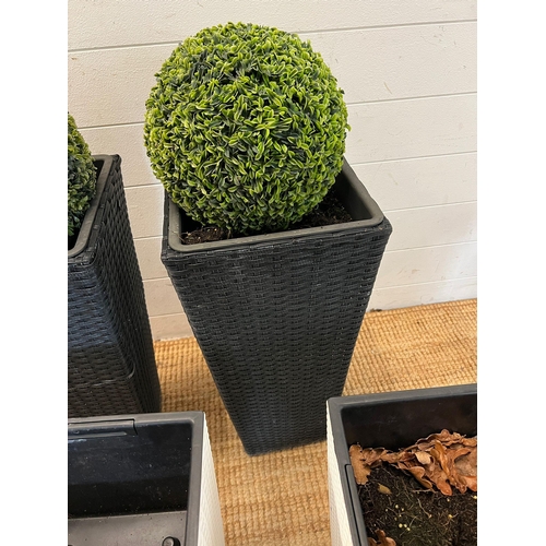 232 - Four rattan planters, two black (H60cm) and two white (H50cm)