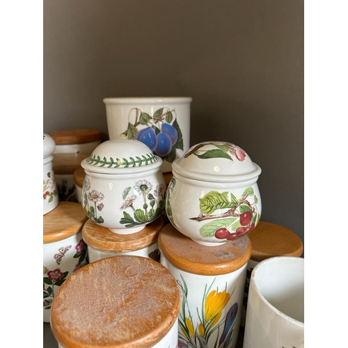 253 - A large quantity of Portmeririon china to include lidded jars, vases and pots