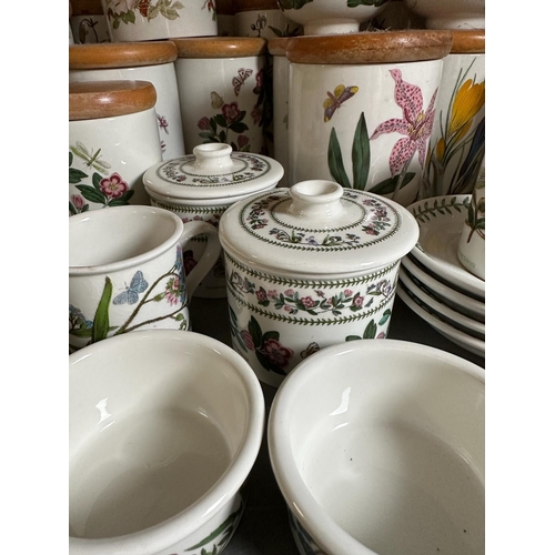 253 - A large quantity of Portmeririon china to include lidded jars, vases and pots