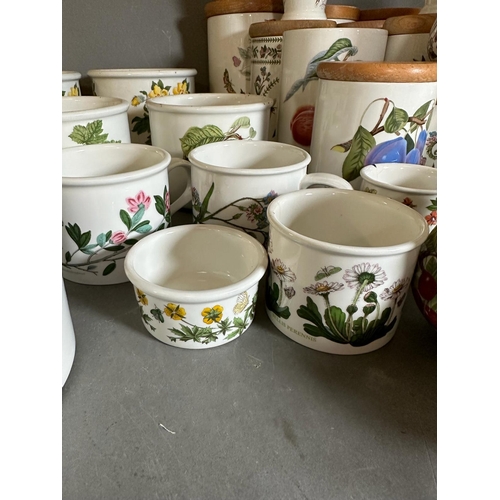 253 - A large quantity of Portmeririon china to include lidded jars, vases and pots