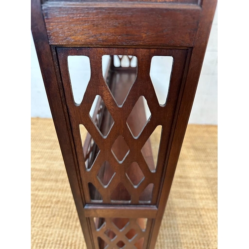 26 - A mahogany three shelf wall hanging bookcase with piece sides and back rail.