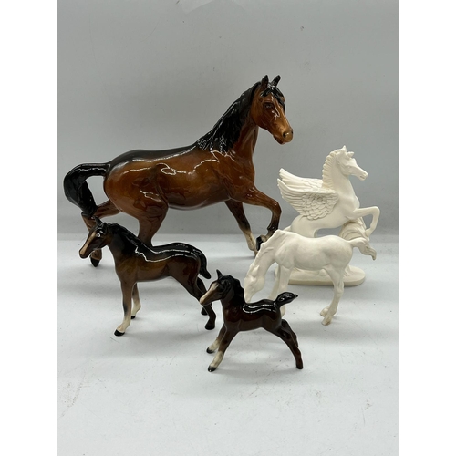 273 - Four Beswick china horses and one alabaster unicorn