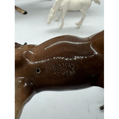 273 - Four Beswick china horses and one alabaster unicorn