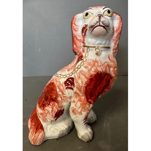 289 - Two 19th Century Staffordshire red and white spaniels (H22.5cm)