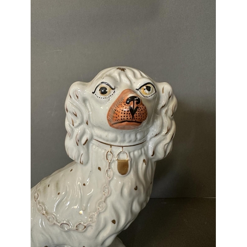 291 - A large 19th Century Staffordshire spaniel in white and gold