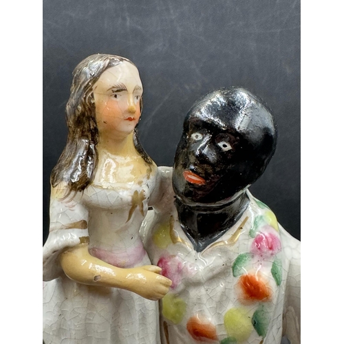 293 - A Staffordshire figure of Uncle Tom and Little Eva