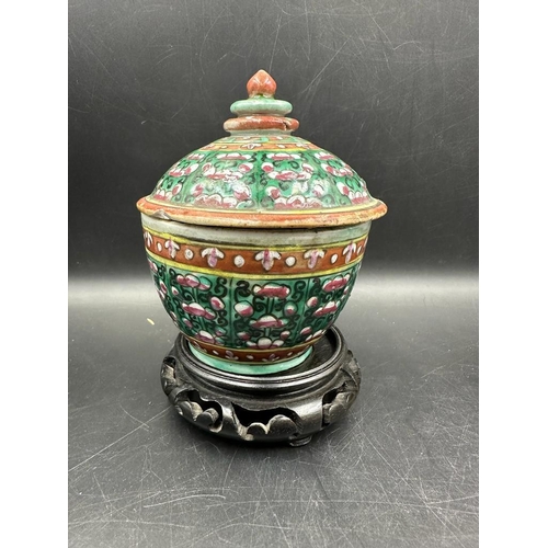 296 - Three Chinese style ceramic items, two lidded jars and a stem dish in the famille rose palette