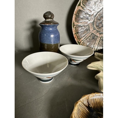 297 - A selection of mixed ceramics to include lidded jars, dishes and serving plates