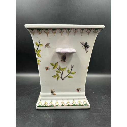 301 - A Chinese square two handled urn or vase with a painted bird and butterfly pattern