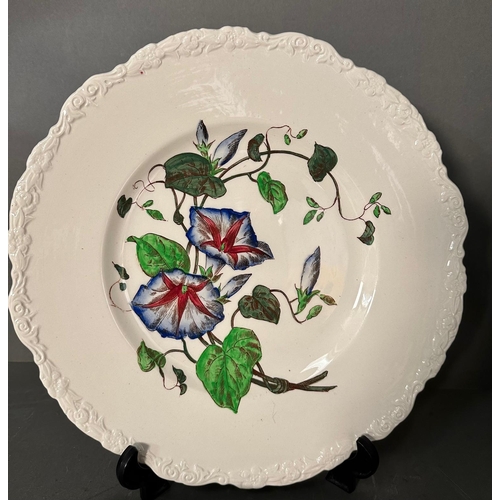 305 - Four Cauldon flower plates 28cm in diameter.