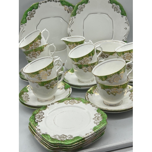 311 - A part tea set of green and gilt pattern by Lawleys