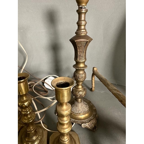 326 - A quantity of brass items to include candlestick, fire dogs and a mirror