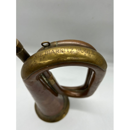 327 - A brass and copper bugle, inscribed 