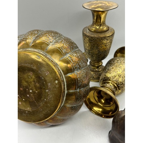 329 - A collection of brass including a laughing buddha and hand warmer/censer