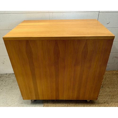 33 - A contemporary three drawer side cabinet on castors