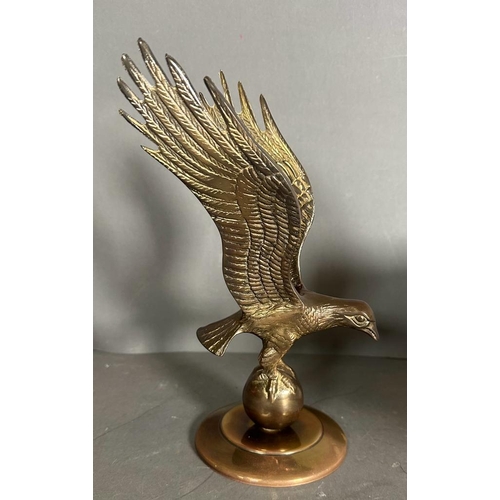 340 - A selection of three trophies to include a brass eagle