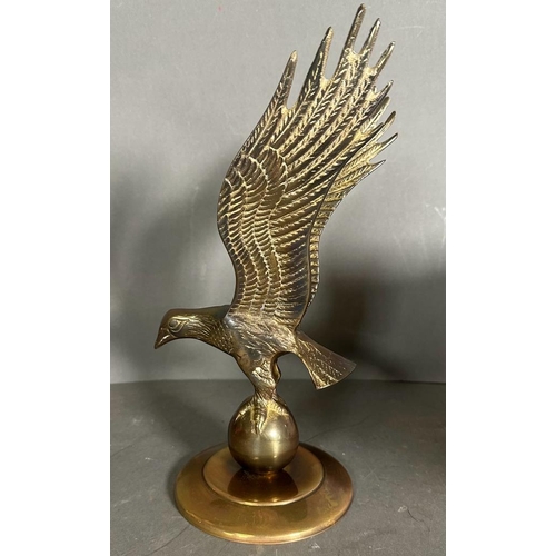 340 - A selection of three trophies to include a brass eagle