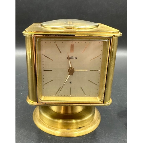 345 - A vintage brass Angelus desk clock/weather station. Having rotating cube shaped body with alarm cloc... 