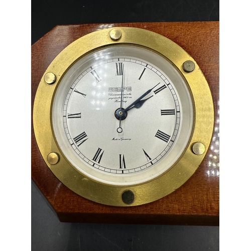 346 - Wempe ships style wall clock and barometer, with circular brass bezels, housed in a shaped mahogany ... 