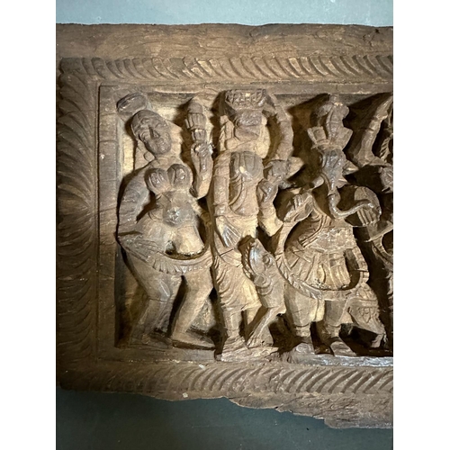 354 - An antique Indian carving brought back from the Scinde Campaign of 1843, featuring carved deities in... 