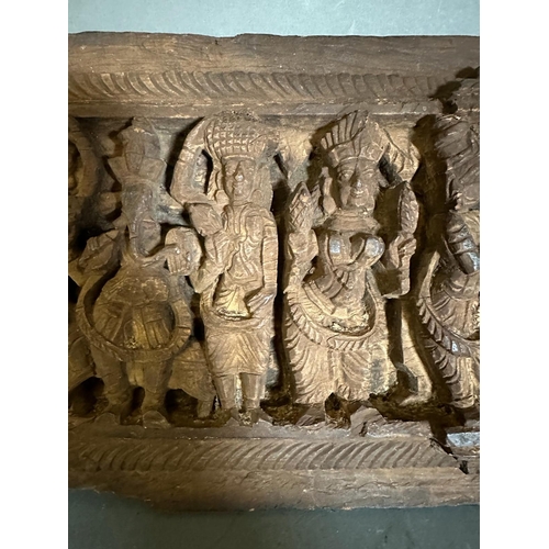 354 - An antique Indian carving brought back from the Scinde Campaign of 1843, featuring carved deities in... 