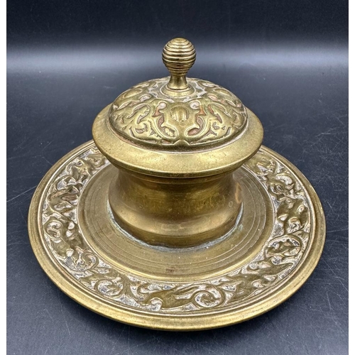 370 - A 19th Century brass inkwell with glass insert and a brass trinket box on feet