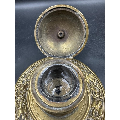 370 - A 19th Century brass inkwell with glass insert and a brass trinket box on feet