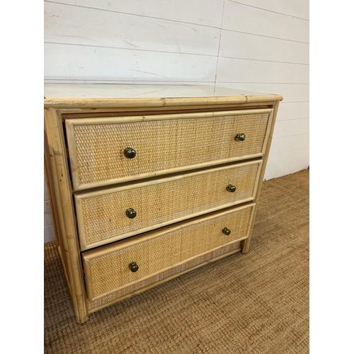 38 - A three drawer bamboo and cane chest of drawers and a matching smaller three drawer chest (H72cm W79... 