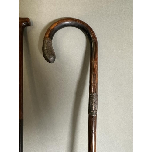 380 - A selection of three vintage walking canes