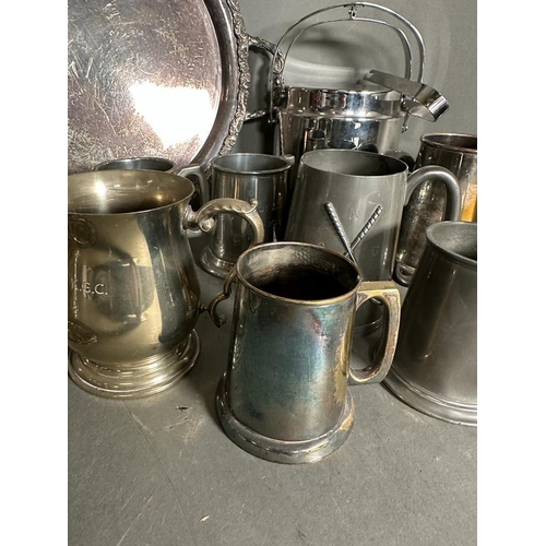 383 - A selection of silver plate, pewter and white metal items to include tankards, tray and a candle sti... 