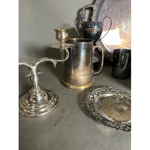 383 - A selection of silver plate, pewter and white metal items to include tankards, tray and a candle sti... 