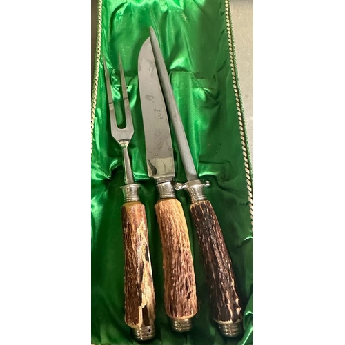 385 - Two boxed fish knives and a boxed horn handled carving set