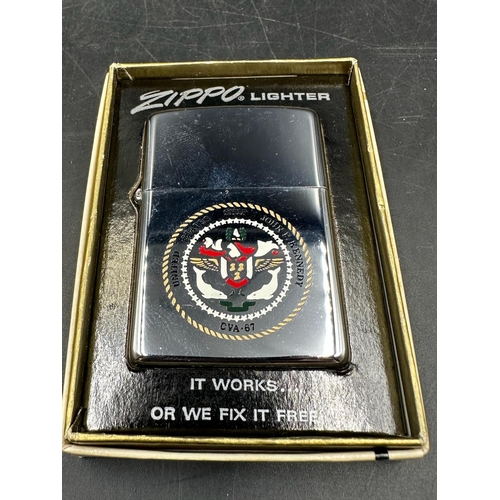 403 - A boxed Zippo lighter with crest of the USS John F Kennedy