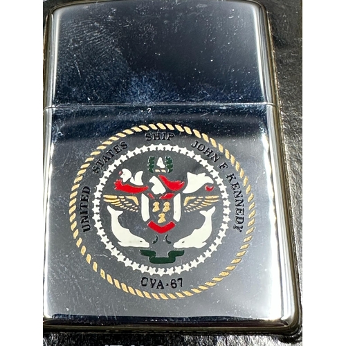 403 - A boxed Zippo lighter with crest of the USS John F Kennedy