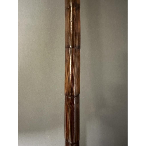 407 - A vintage bamboo walking cane with 18ct rolled hold handle tip