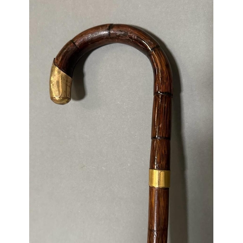 407 - A vintage bamboo walking cane with 18ct rolled hold handle tip